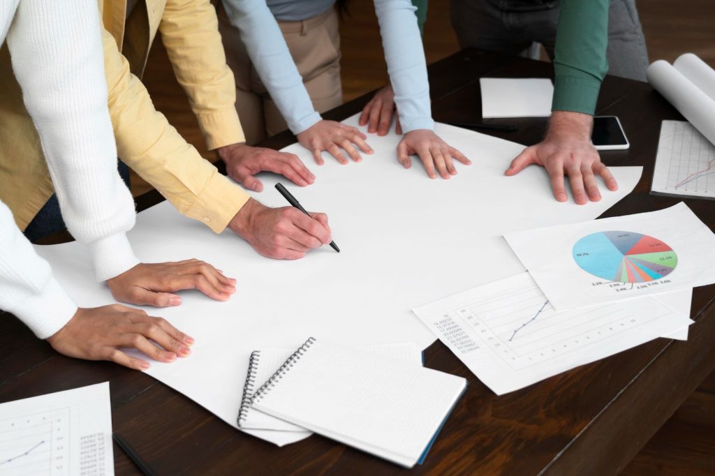 Close up of corporate workers brainstorming together